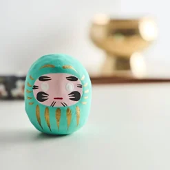 Petit daruma turquoise réussite scolaire